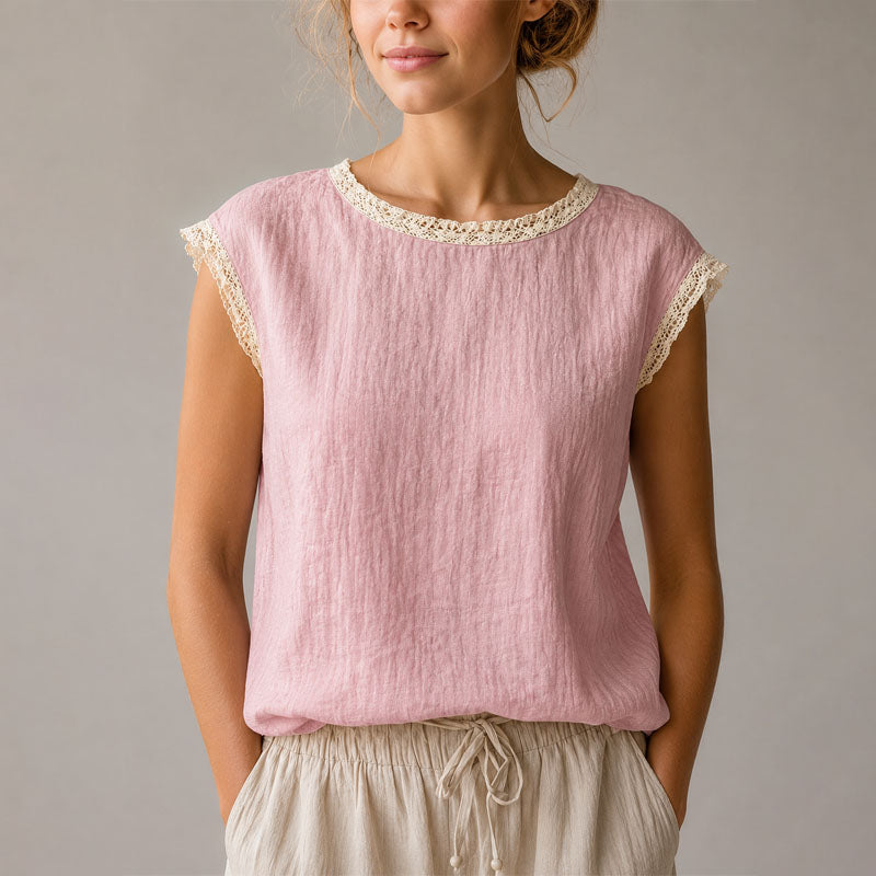 Stylish women's relaxed fit blouse with elegant lace trim, great for a smart casual outfit.