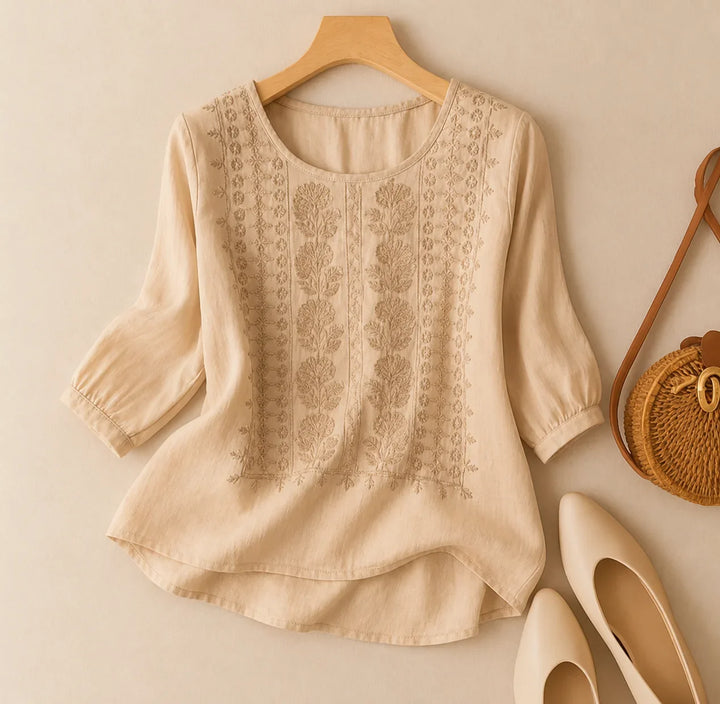 Stylish women's puff sleeve blouse. Features delicate floral embroidery, a round neck & relaxed fit for comfort.