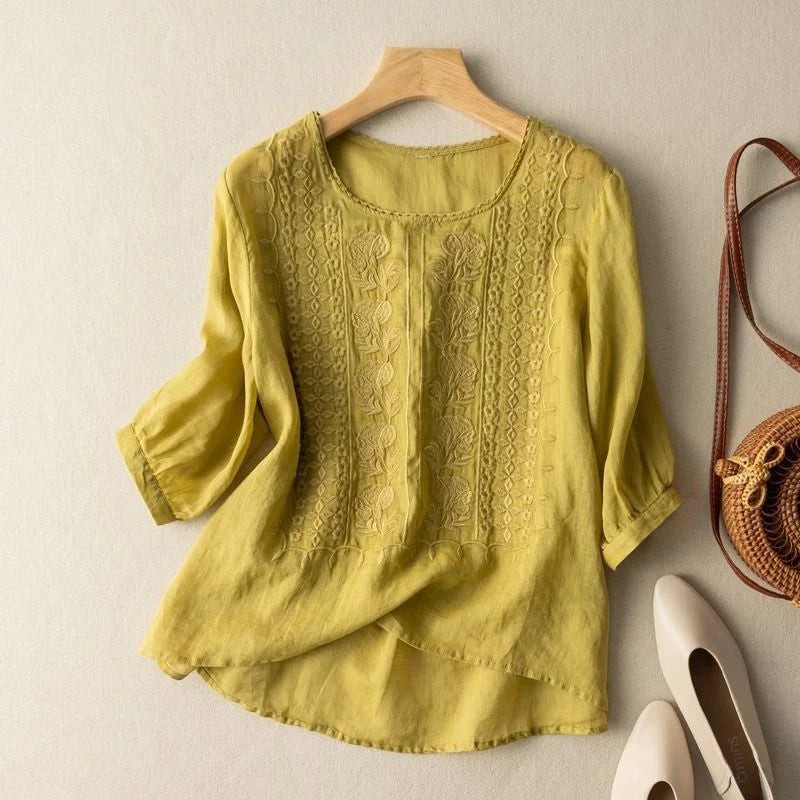 Chic women's spring blouse featuring detailed floral embroidery, puff sleeves & a relaxed, comfortable fit.