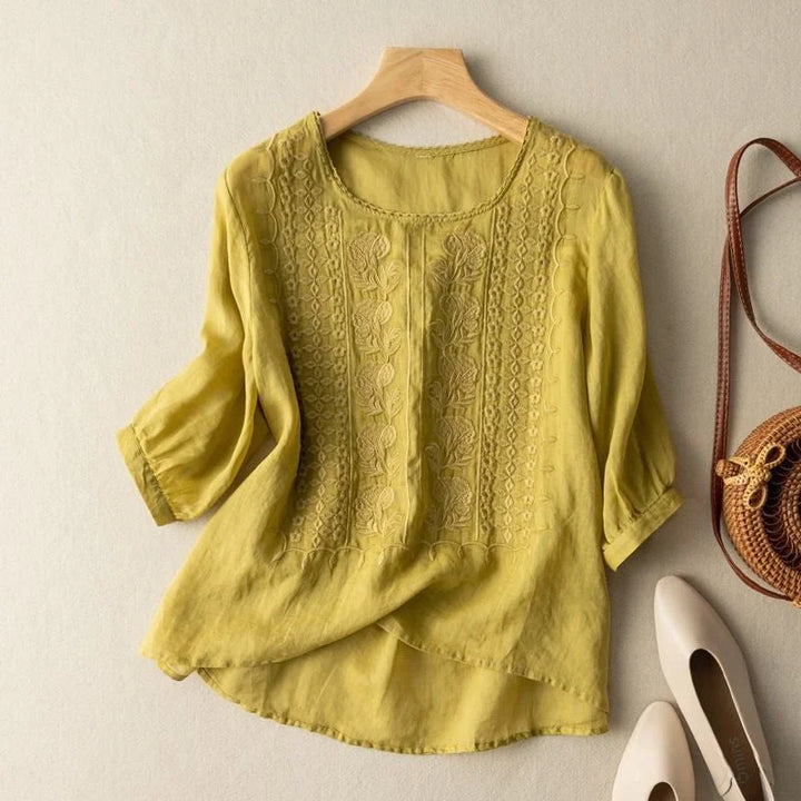 Chic women's spring blouse featuring detailed floral embroidery, puff sleeves & a relaxed, comfortable fit.