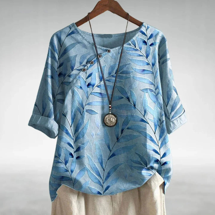 Women's relaxed fit botanical print blouse with 3/4 sleeves, perfect for spring and summer casual wear.