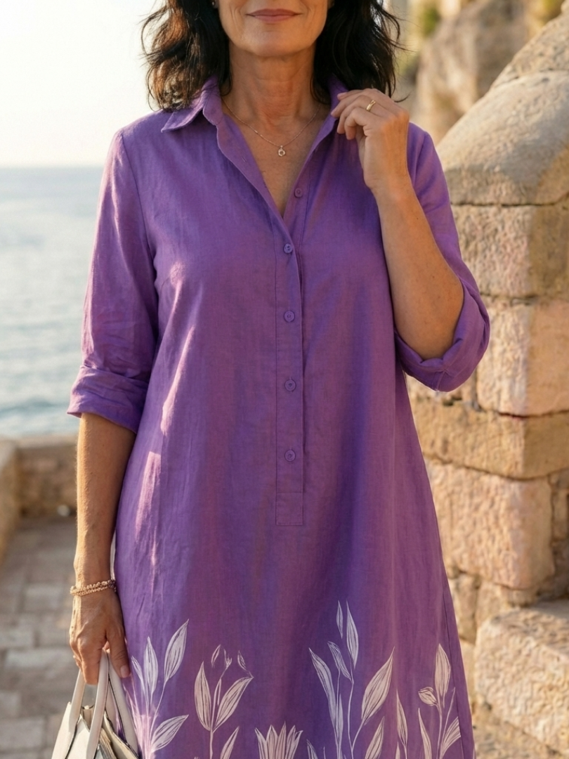 Stylish women's purple botanical print casual evening dress. Relaxed fit, knee-length, ideal for garden parties & elegant events.