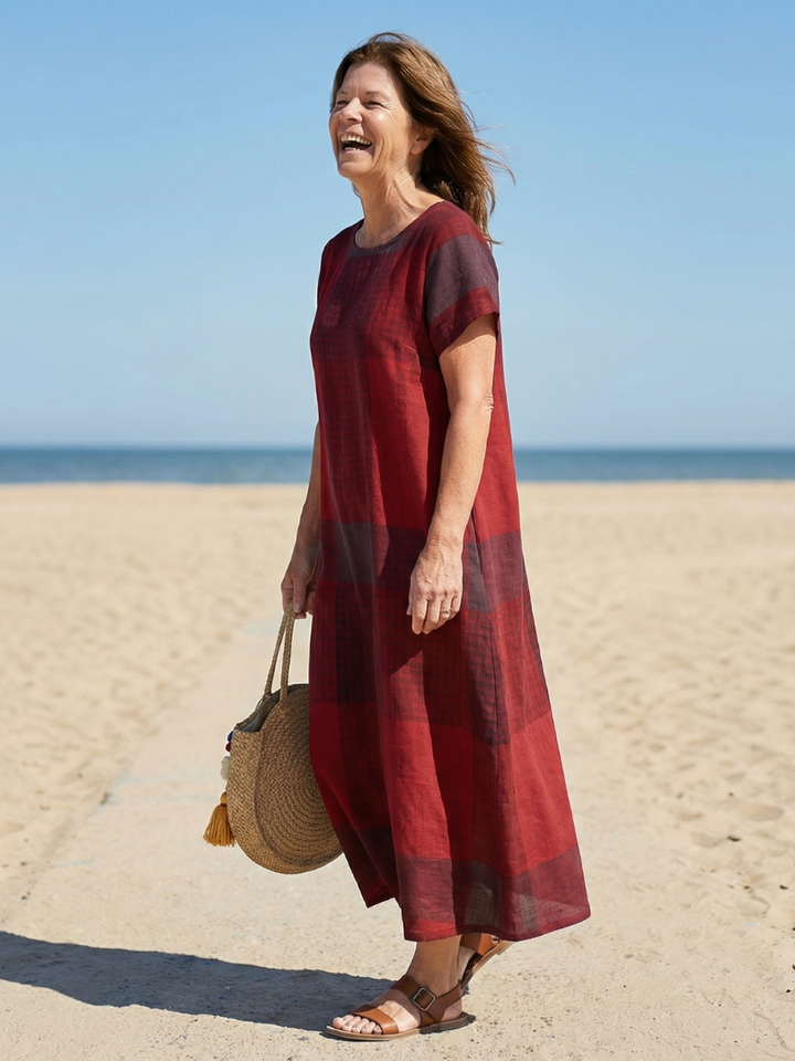 Comfortable women's short sleeve midi dress in a relaxed plaid design, ideal for casual everyday wear.
