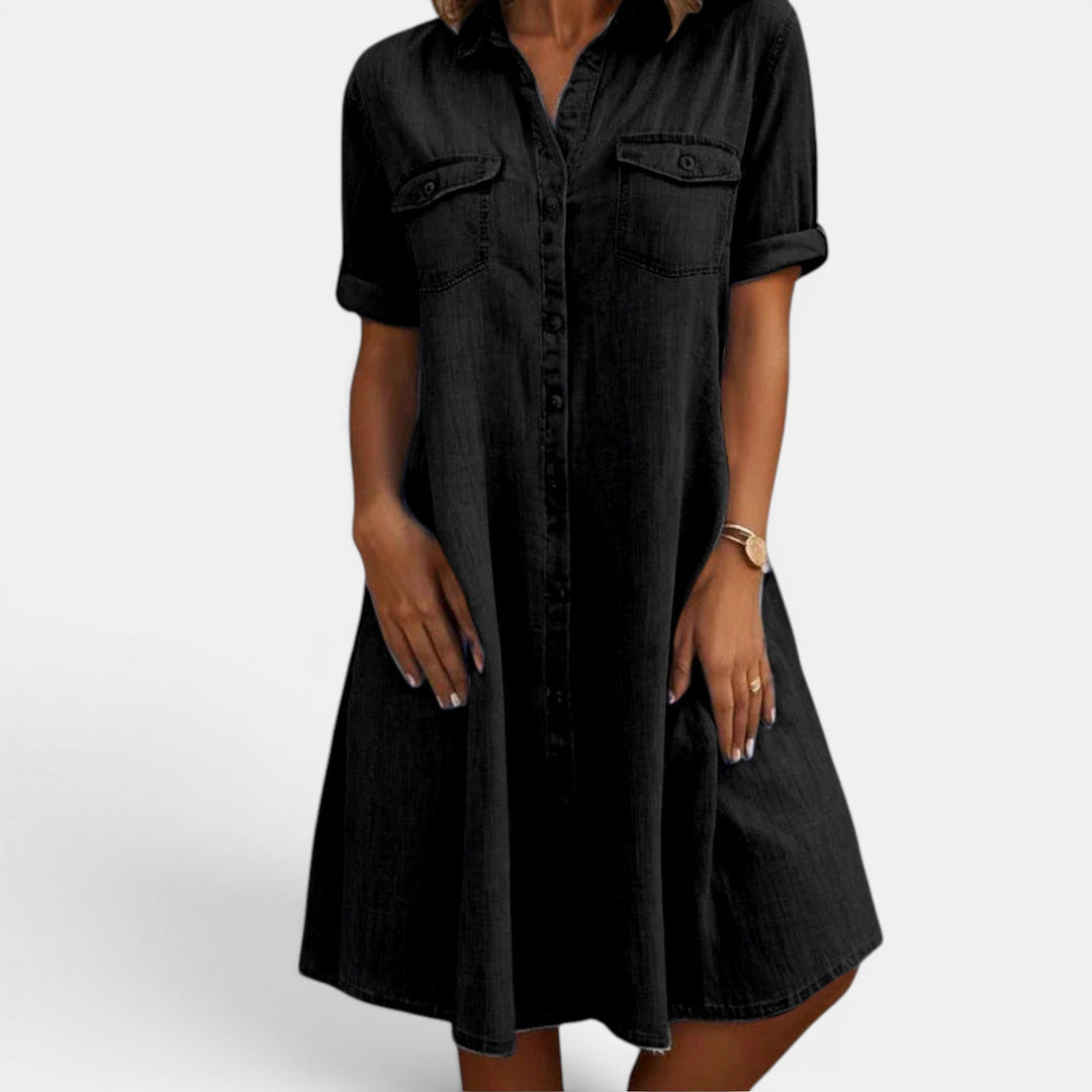 Women's midi shirt dress with a full button front & relaxed fit. Versatile for casual or everyday wear.