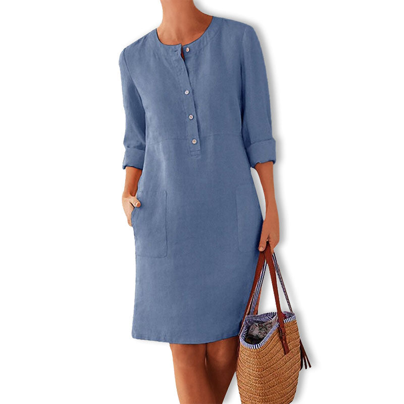 Women's relaxed fit button front midi summer dress with convenient pockets for casual warm-weather style.