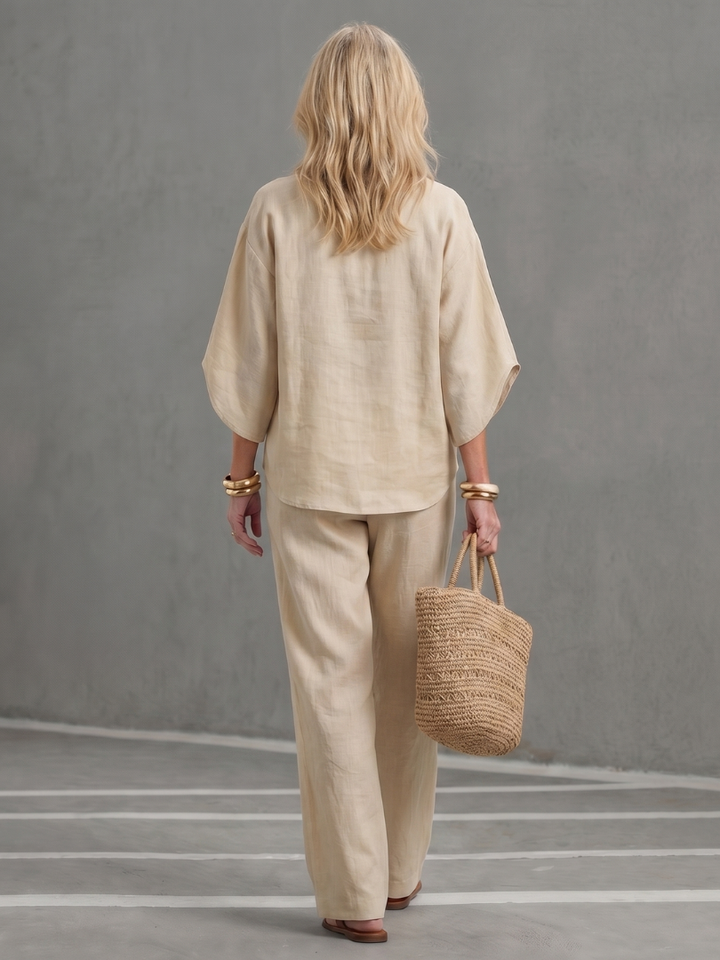 Elegant women's relaxed fit tunic set with straight leg trousers, ideal for office or leisure.