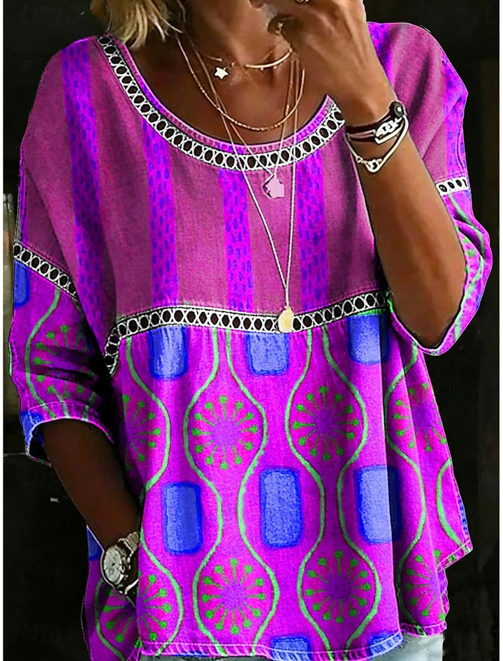 Women's relaxed fit embroidered everyday top. Casual, comfortable blouse with three-quarter sleeves & round neck.