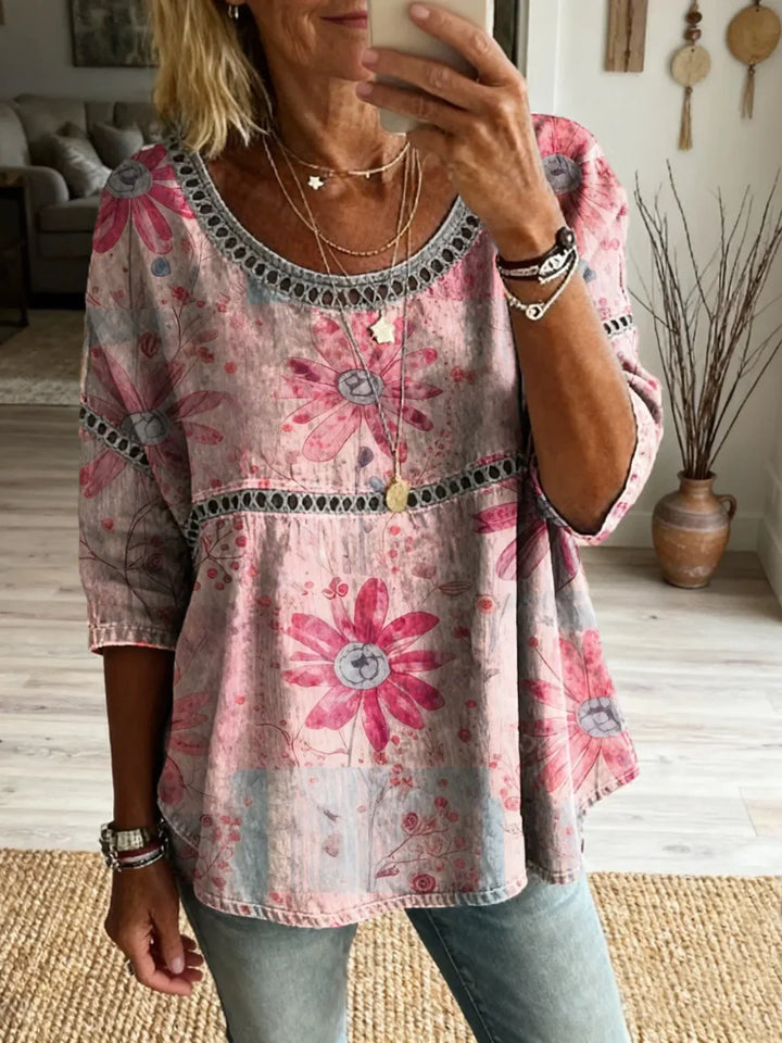 Close-up: intricate embroidery on women's relaxed fit everyday top. Stylish, comfortable blouse for casual wear.