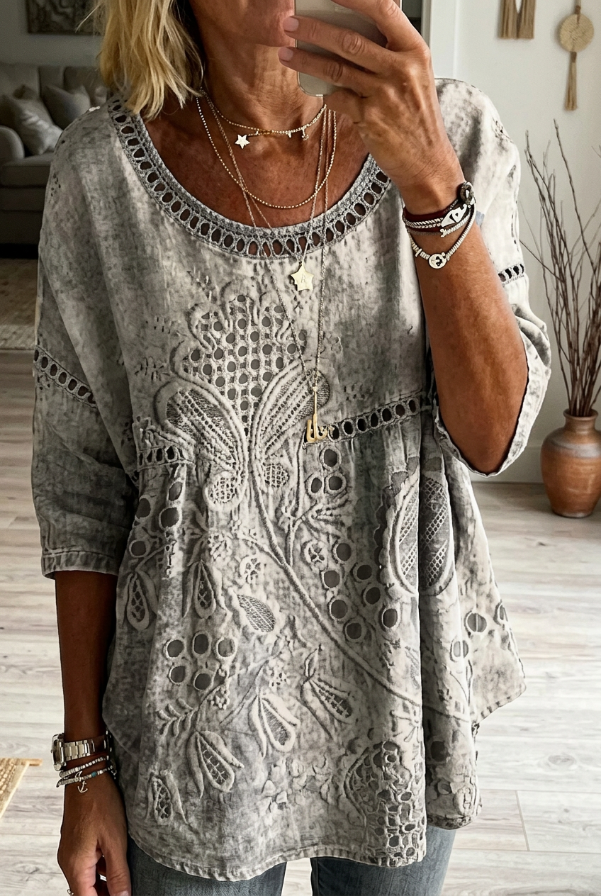 Soft, relaxed fit women's embroidered everyday blouse. Three-quarter sleeve, round neck top for versatile casual style.