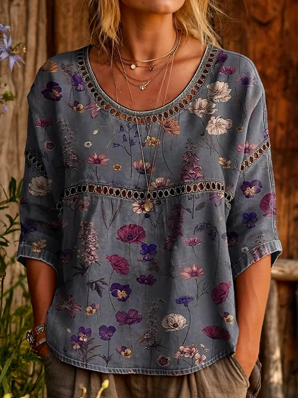 Detail of a women's relaxed fit embroidered top. Round neck, three-quarter sleeves for stylish, comfortable everyday wear.