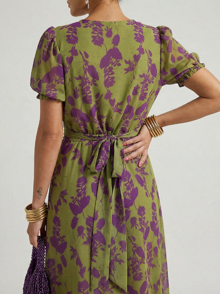 Lightweight women's summer floral midi dress, designed with a stylish wrap V-neck and short sleeves for comfort.