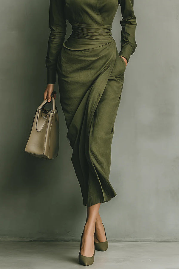 Classic women's green midi dress with a relaxed fit, long sleeves, and practical button-front closure for everyday wear.