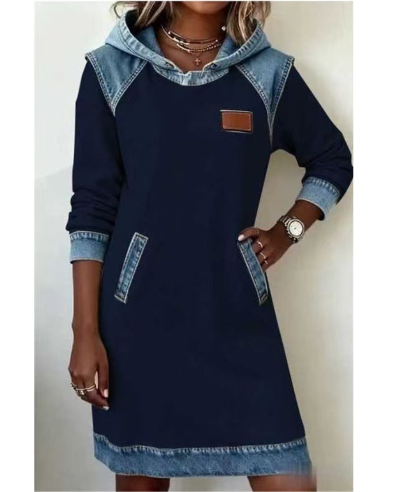Stylish woman wearing a relaxed fit hooded dress, showcasing its long sleeves & comfortable casual design.