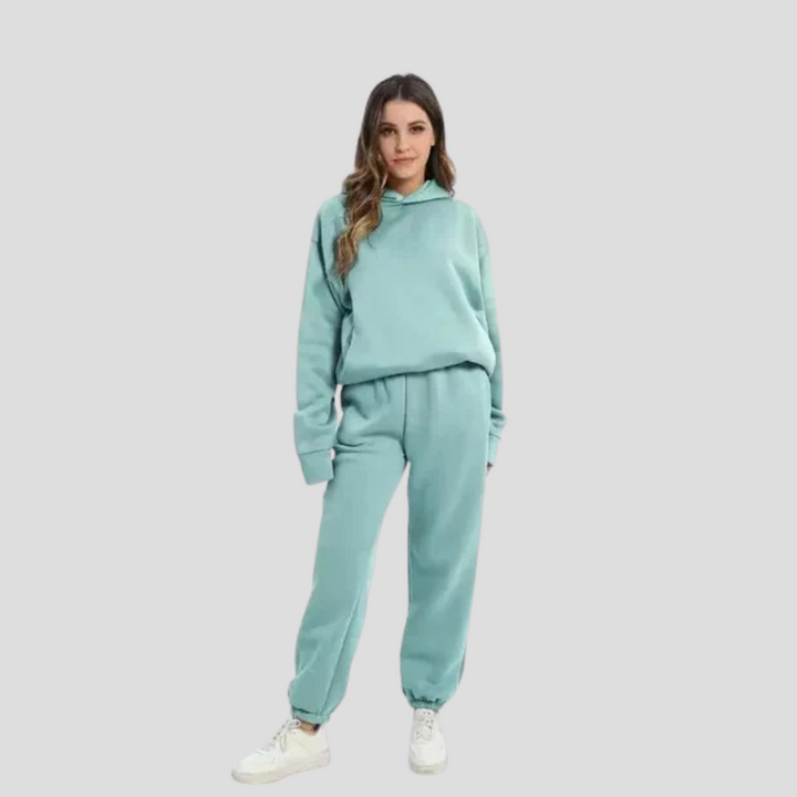 Stylish women's hooded tracksuit, a comfortable two-piece jogger and hoodie set for casual winter fashion.