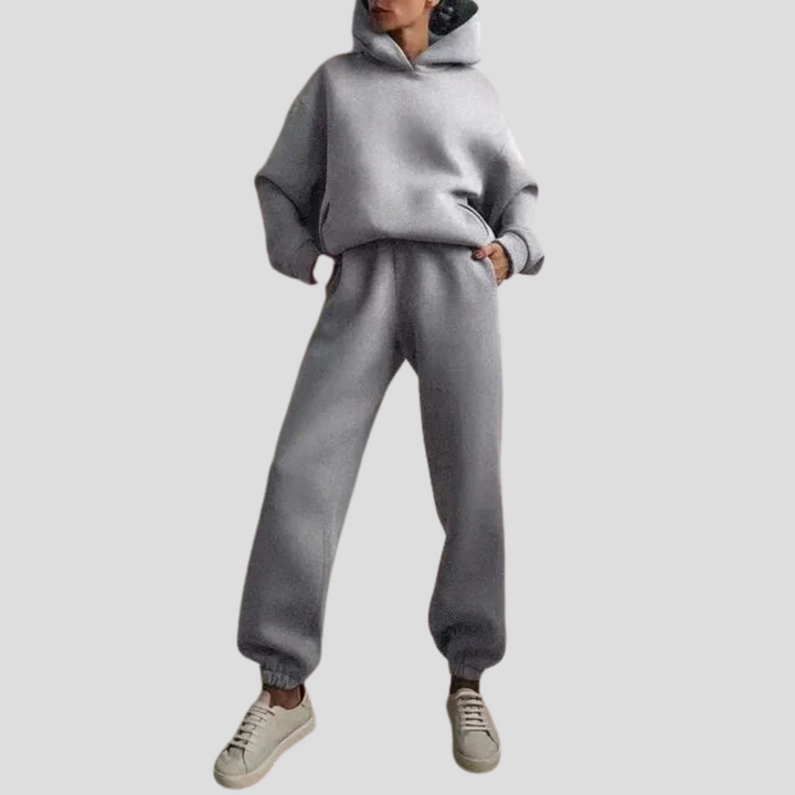 New women's relaxed fit hoodie and jogger set. Cozy winter loungewear, a perfect two-piece casual outfit.