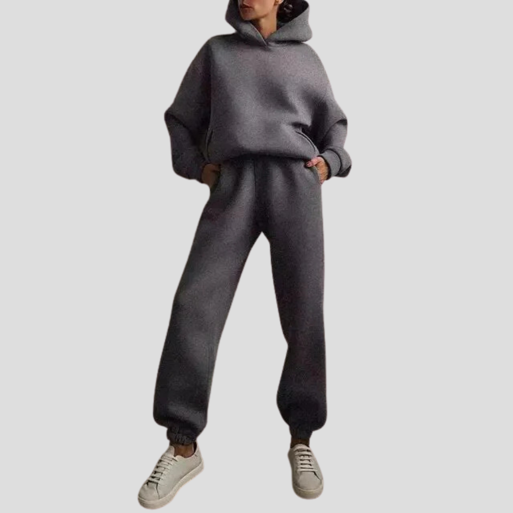Women's comfortable long-sleeve hoodie and matching jogger pants set for relaxed winter loungewear.