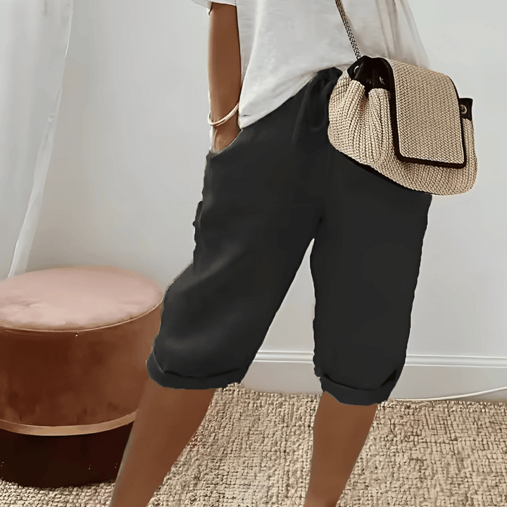 Comfortable women's relaxed fit harem shorts, knee-length, ideal for casual wear & summer relaxation.