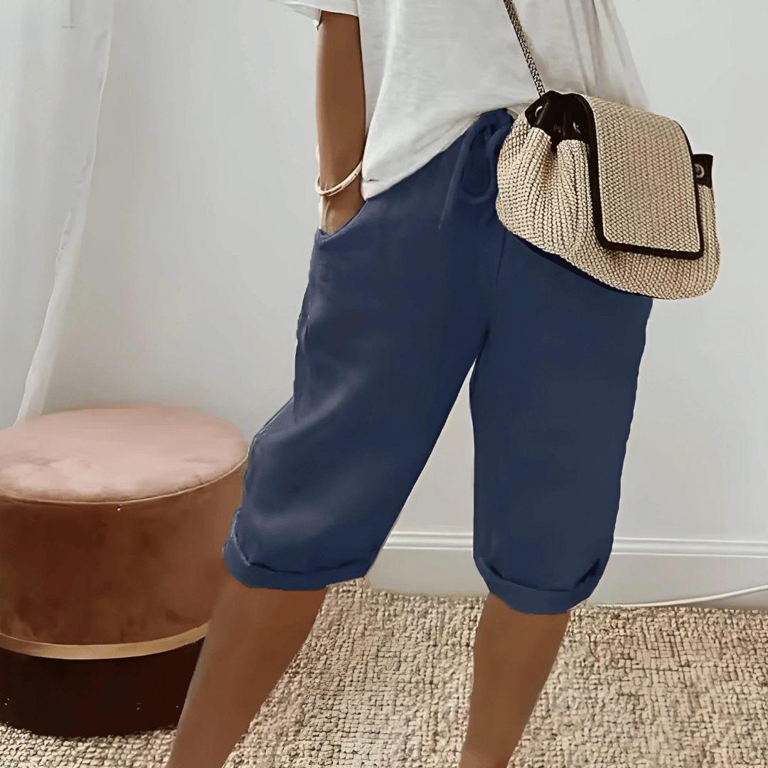Relaxed fit women's knee-length harem shorts, comfortable & versatile for casual summer fashion.