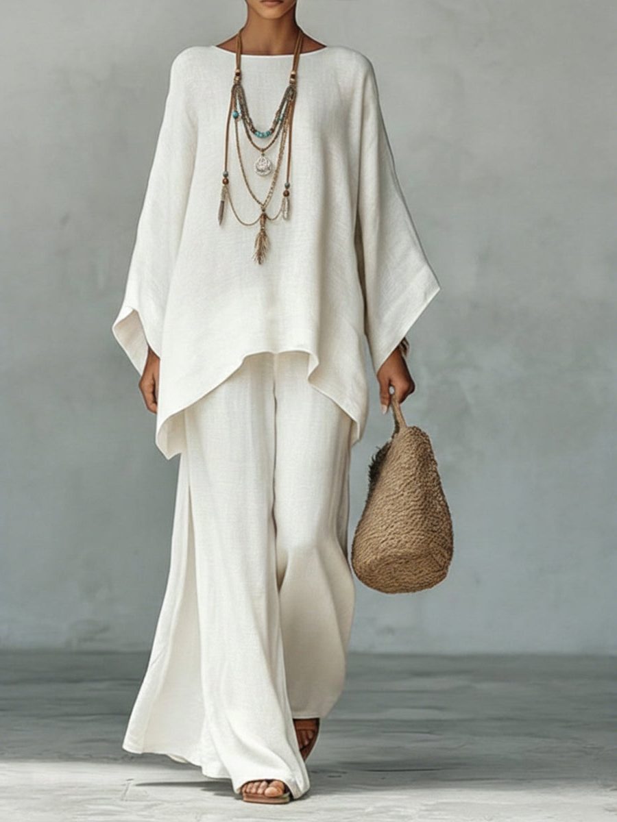 Women's comfortable linen two-piece set featuring a poncho top and straight leg maxi pants.