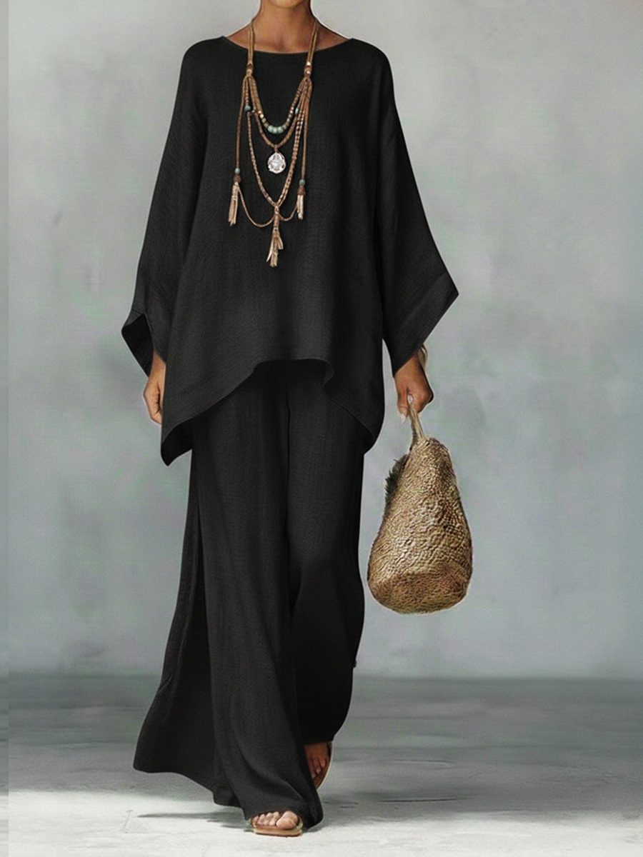 Women's comfortable linen two-piece set, with a relaxed poncho top & straight leg pants, perfect for summer.