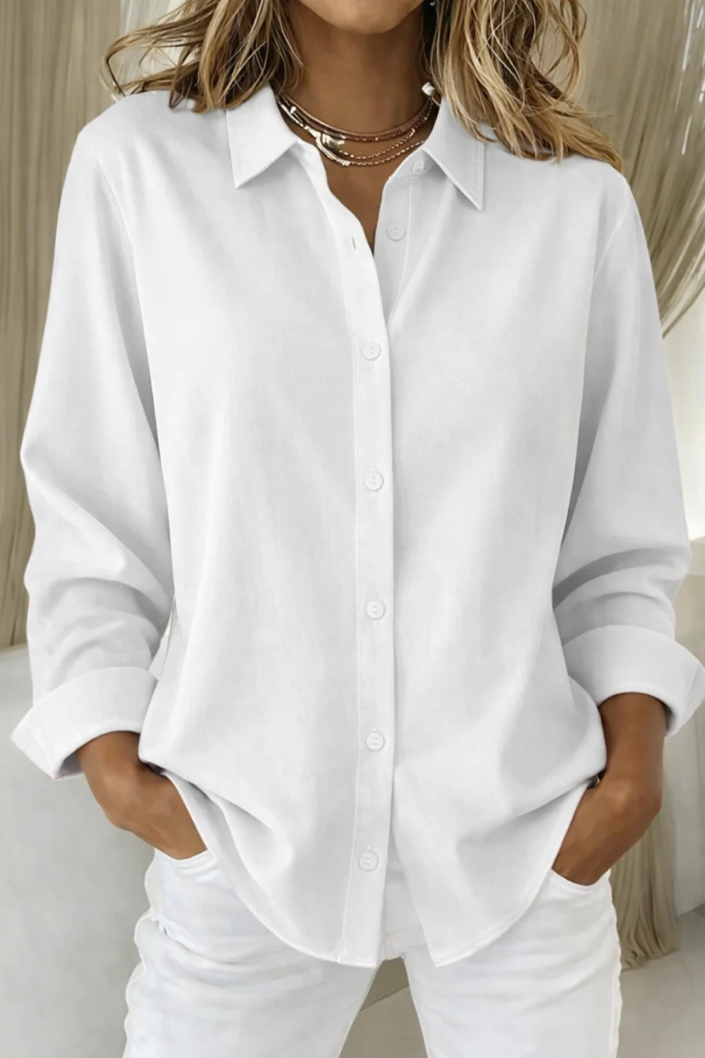 Comfortable women's relaxed fit long sleeve button-down collared shirt, ideal for everyday wear.