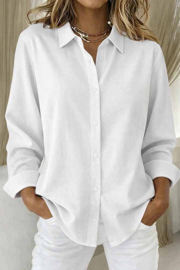 Comfortable women's relaxed fit long sleeve button-down collared shirt, ideal for everyday wear.