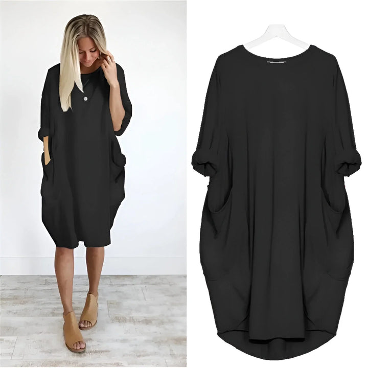 Women's relaxed fit midi dress with 3/4 sleeves & practical pockets, ideal for casual summer wear.