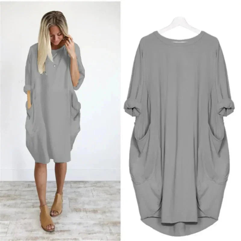 Stylish women's midi dress featuring 3/4 sleeves & functional pockets, designed for relaxed comfort.