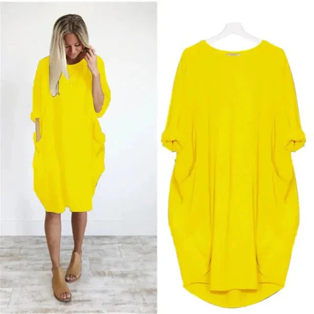 Chic women's relaxed fit midi dress, 3/4 sleeves & pockets, combining casual style with comfort.