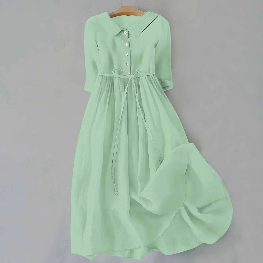 Flowy relaxed fit midi dress for women, featuring a collar, 3/4 sleeves, and a flattering tie waist.