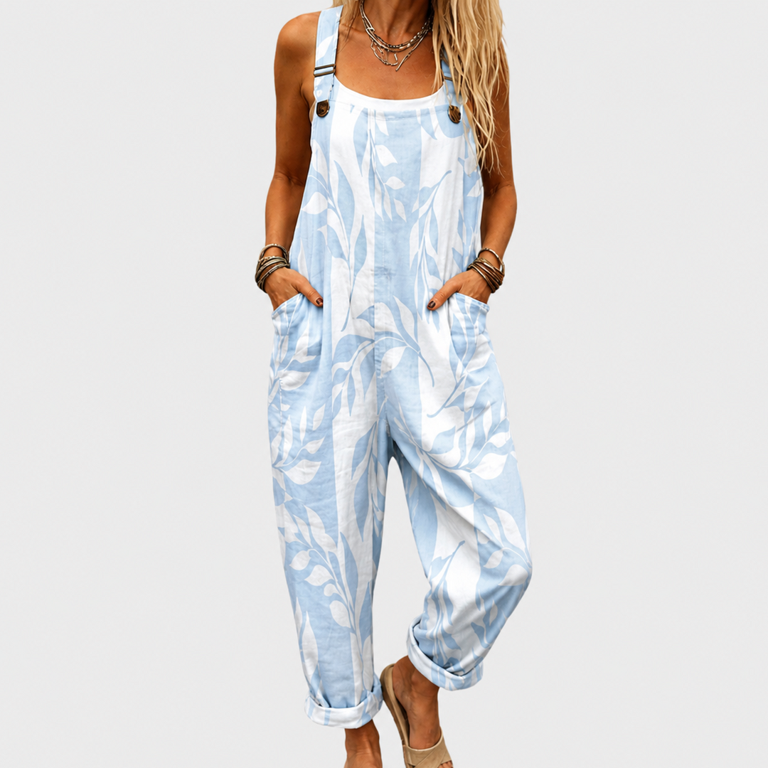 Women's relaxed fit printed wide-leg jumpsuit with adjustable straps, perfect for comfortable summer travel wear.
