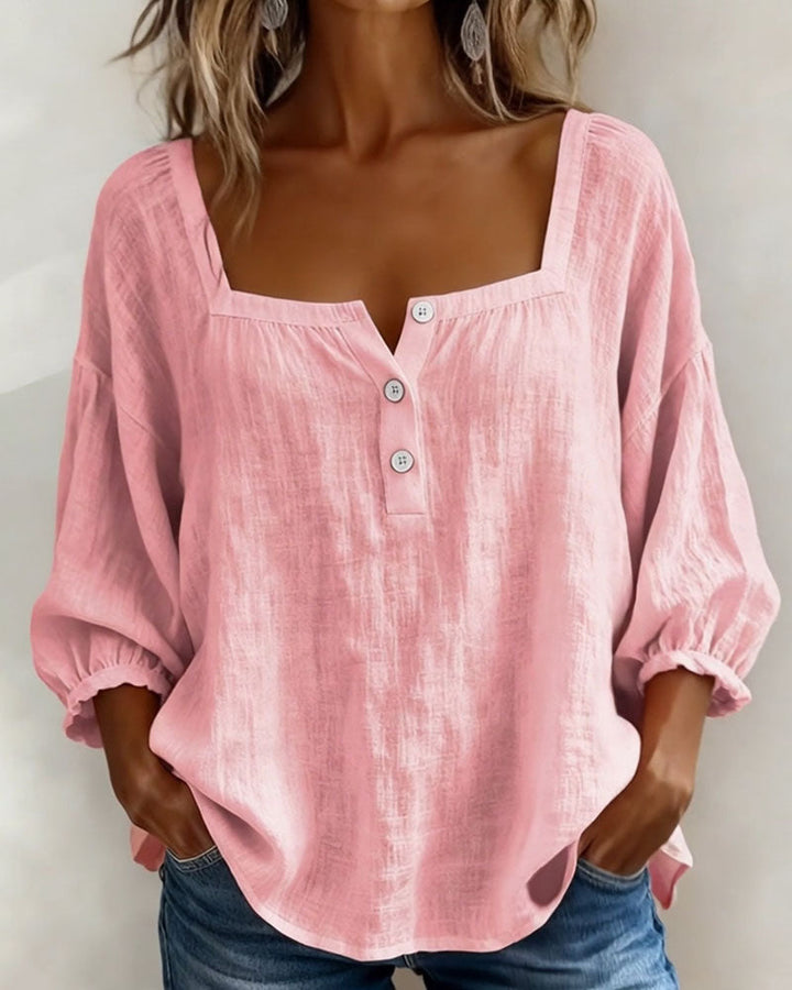 Women's relaxed fit puff sleeve blouse with elegant square neck. A chic summer top.
