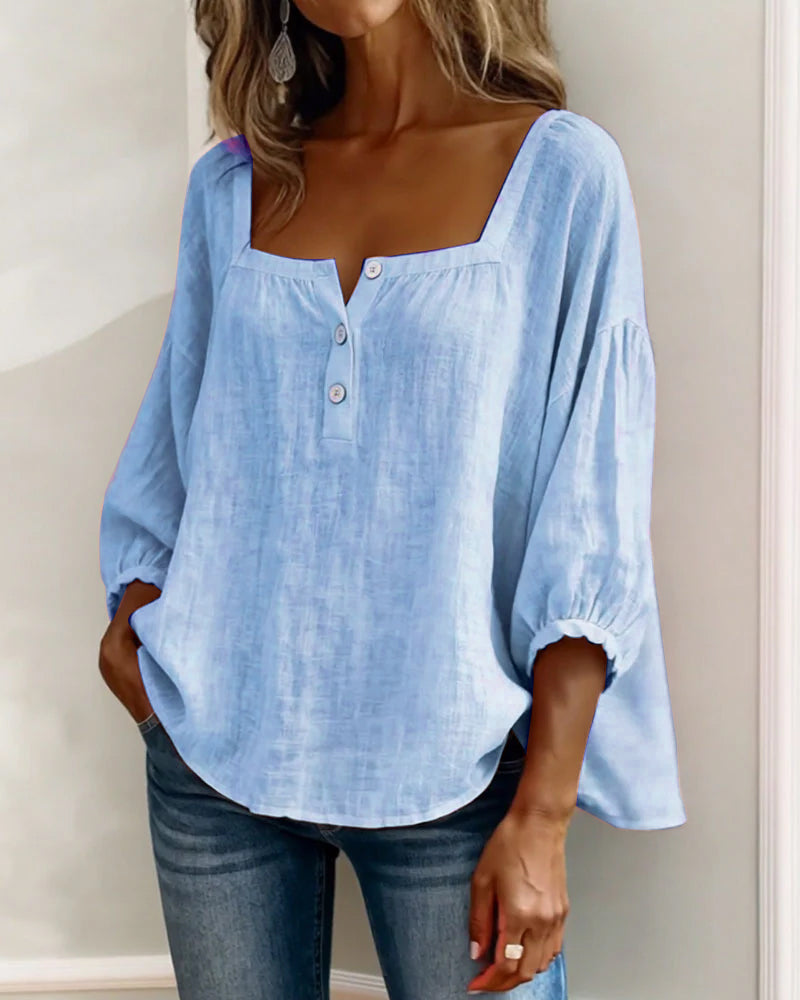 Relaxed fit women's top, elegant puff sleeves, square neck, and versatile for any occasion.