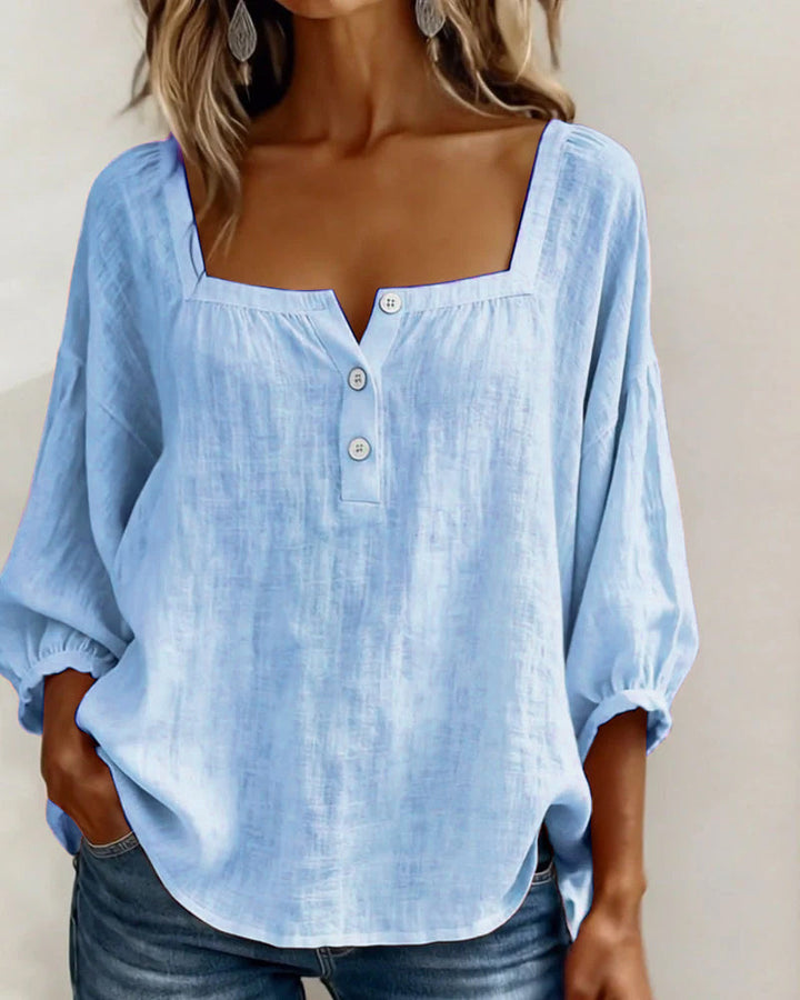 Stylish women's blouse with charming puff sleeves, square neck, and a comfortable relaxed fit.