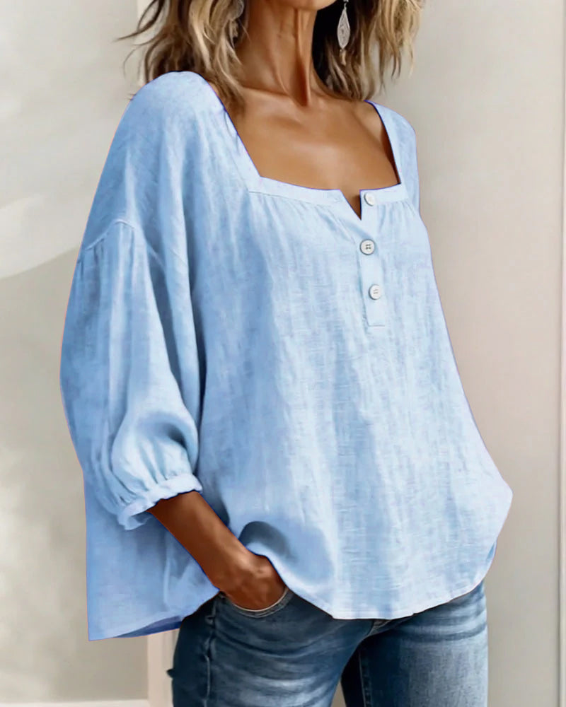 Elegant women's puff sleeve top, square neck, button front, and a modern relaxed cut.