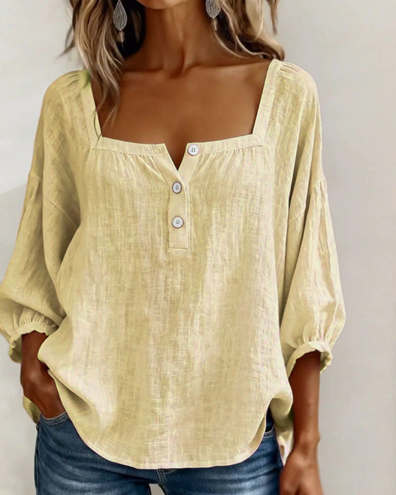 Fashionable women's blouse, relaxed fit, elegant puff sleeves, and a classic square neckline.