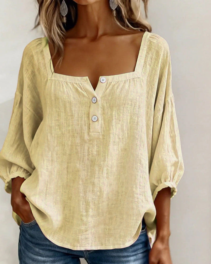 Fashionable women's blouse, relaxed fit, elegant puff sleeves, and a classic square neckline.