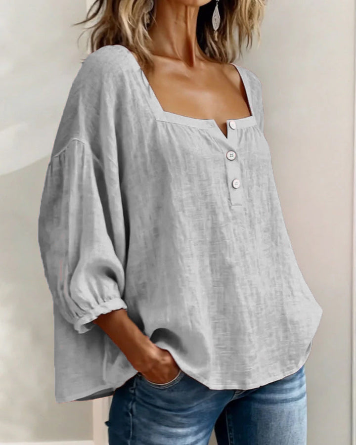 Elegant women's top with relaxed fit, puff sleeves, and a flattering square neck for chic looks.