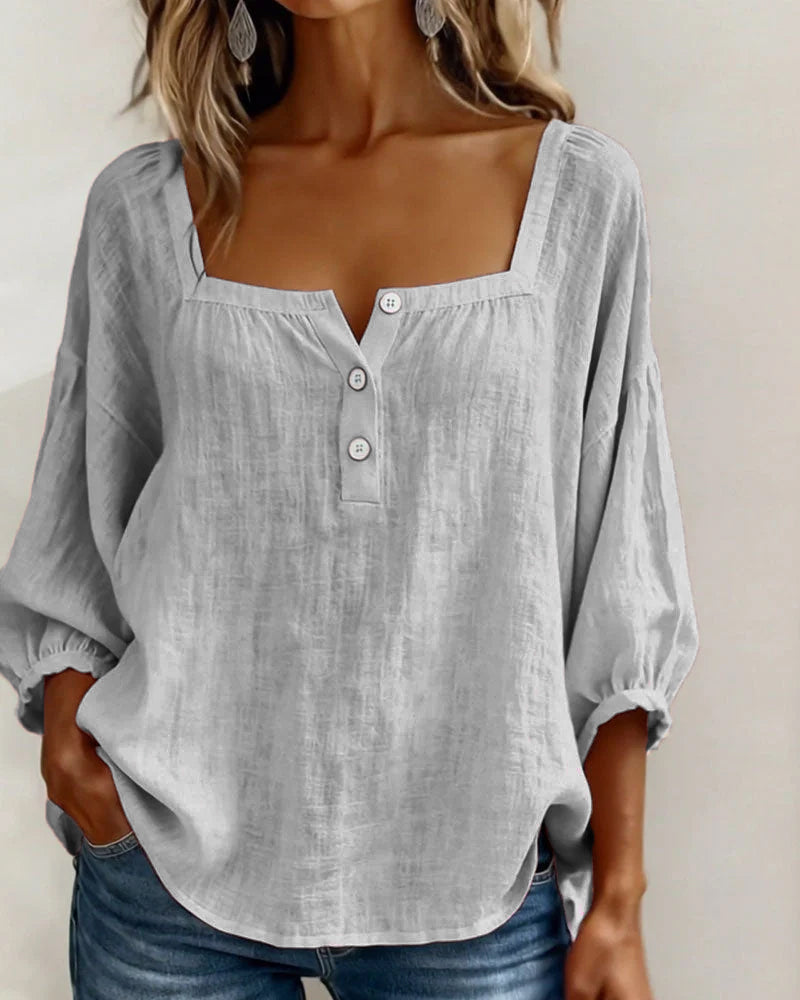 Summer women's top: relaxed fit, puff sleeves, square neck, and elegant for any outing.