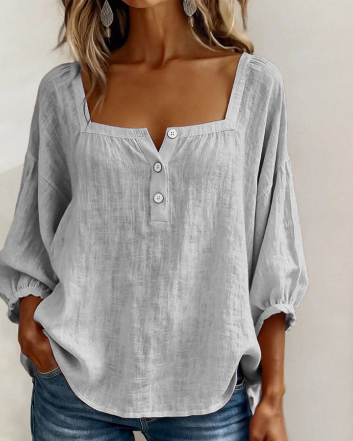 Summer women's top: relaxed fit, puff sleeves, square neck, and elegant for any outing.