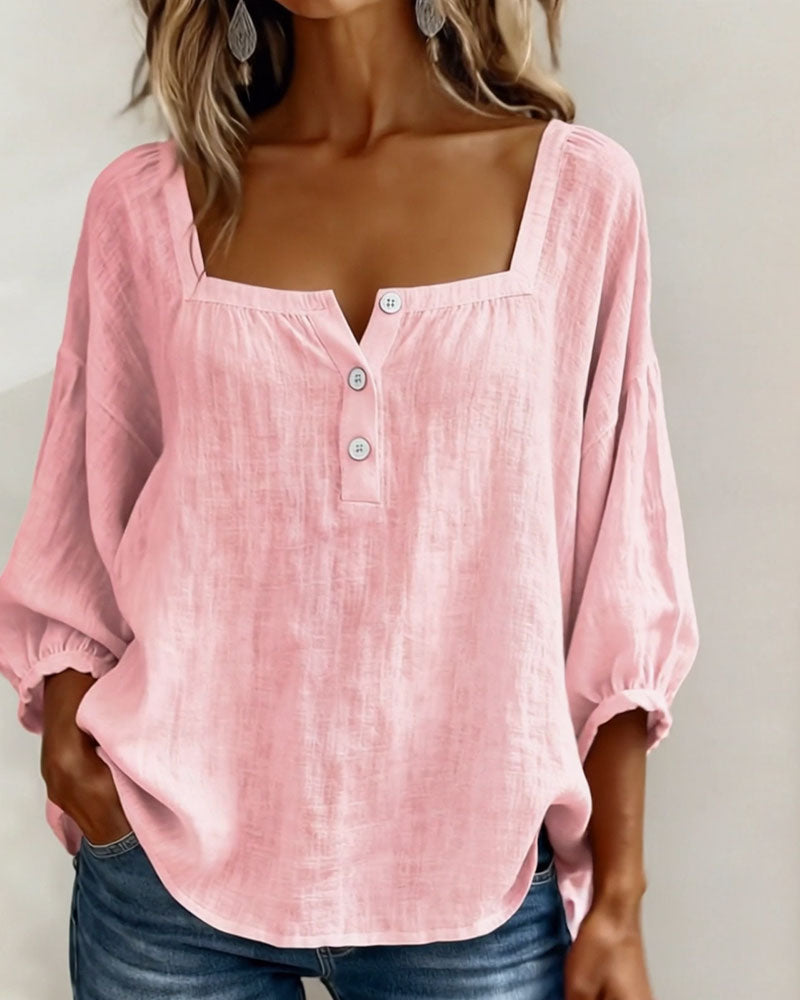 Elegant women's top featuring puff sleeves, a flattering square neck, and relaxed fit.