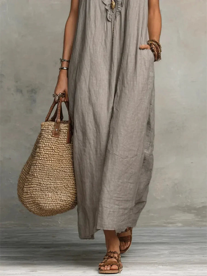 Chic women's relaxed fit maxi dress, sleeveless with ruffles and pockets, perfect for summer elegance.