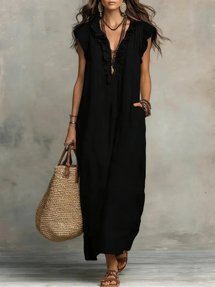 Casual women's sleeveless maxi dress with a v-neck, ruffles, and pockets for everyday style.