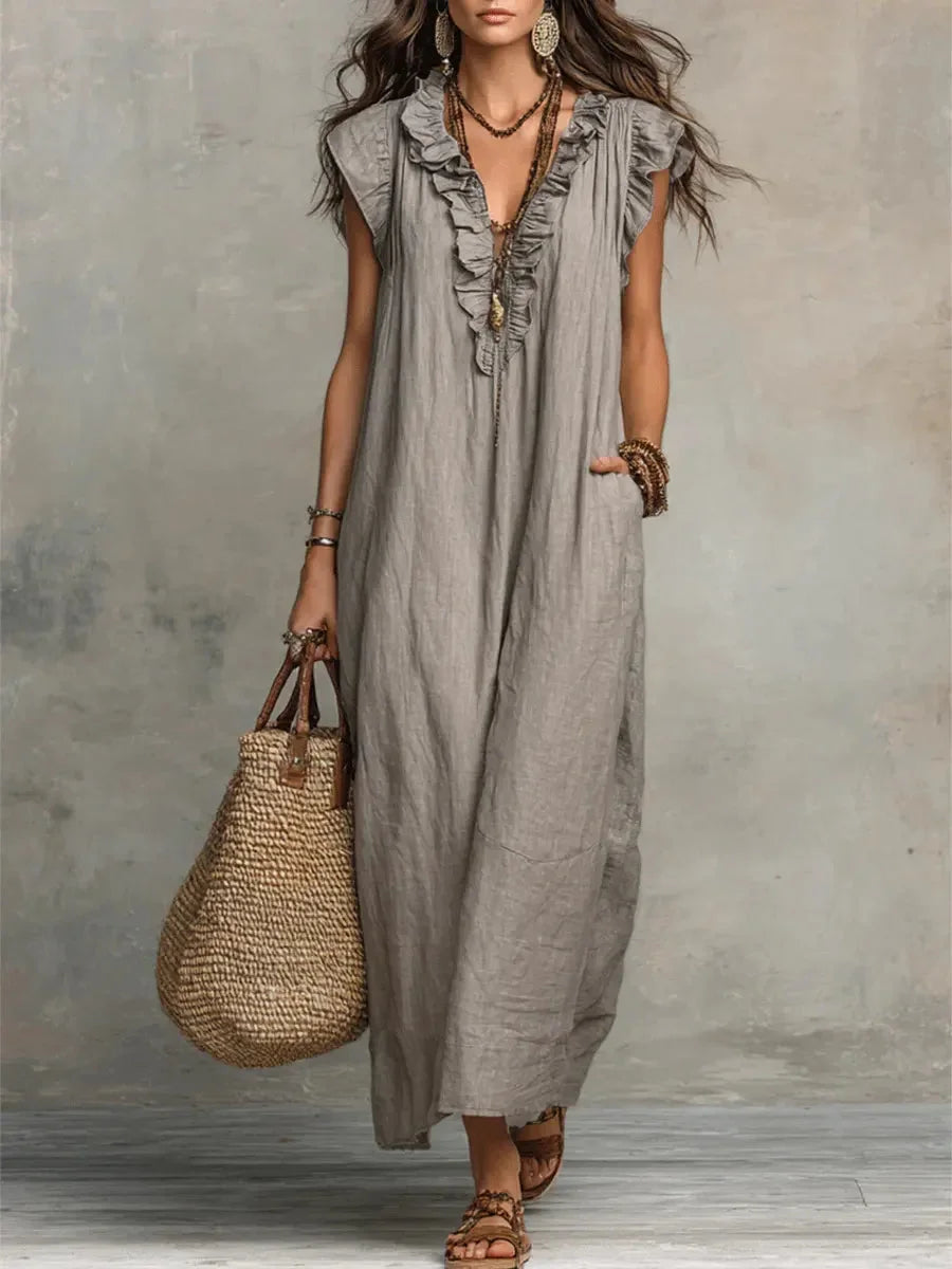 Elegant women's ruffle maxi dress with a relaxed fit and pockets, perfect for summer vacations.