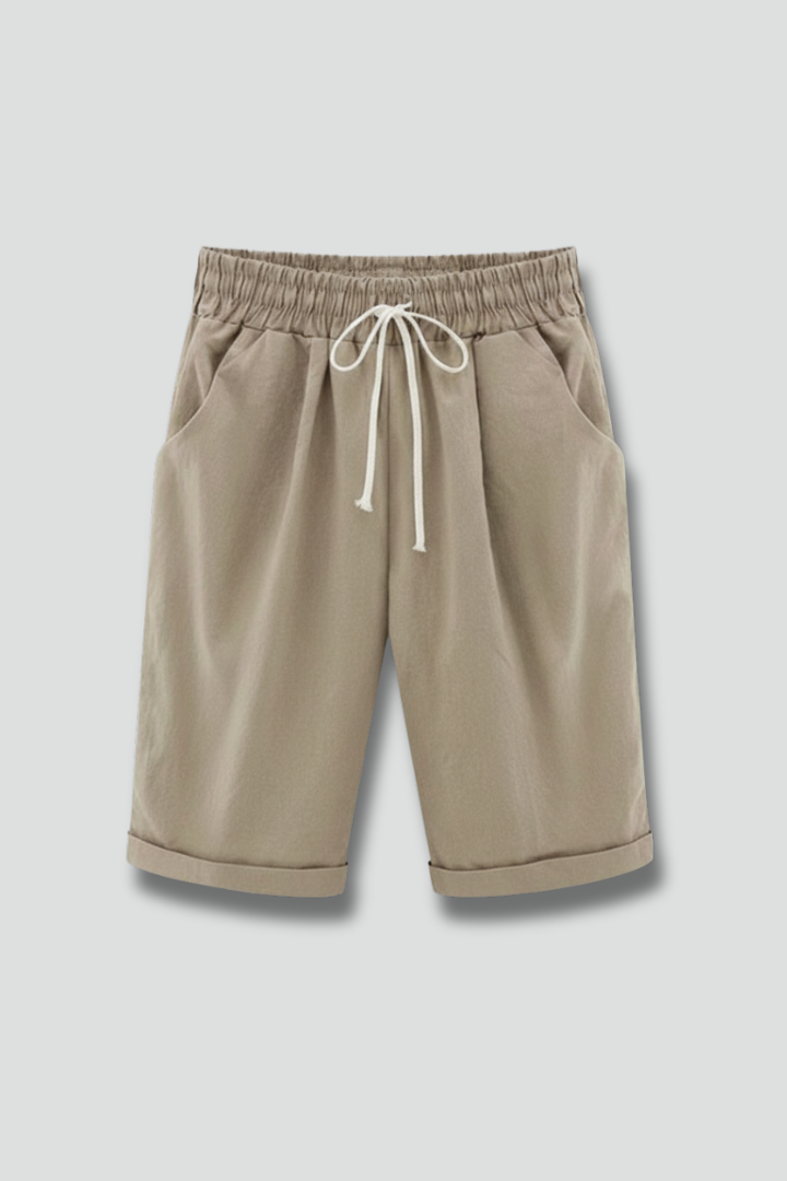 Women's relaxed fit shorts with drawstring waist & pockets, perfect for casual summer comfort.