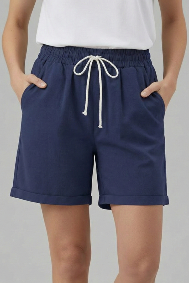 Women's relaxed fit shorts, features drawstring waist, and handy side pockets for a casual, relaxed look.