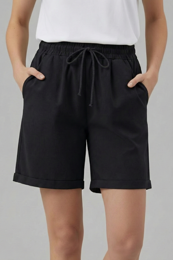 Versatile women's drawstring shorts, relaxed fit with convenient pockets, great for everyday casual outings.
