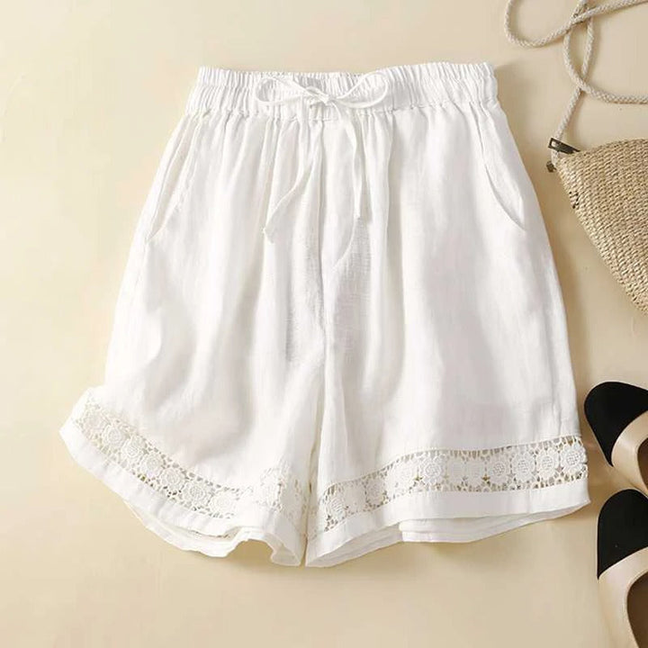 Women's relaxed fit shorts with elastic waist, drawstring, and stylish trim. Perfect for casual summer wear.