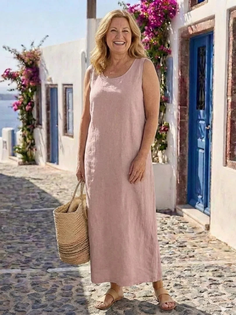 Elegant yet casual women's sleeveless maxi dress with a round neck, offering a relaxed and flowy fit for summer.