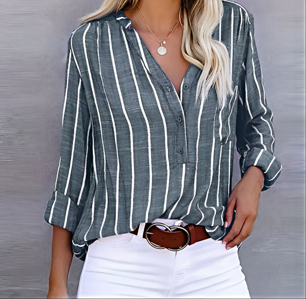 Women's relaxed fit striped button-down shirt. Comfortable long-sleeve blouse for everyday casual or office wear.